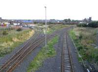 View north east from Ayr Harbour Junction on 2 September 2009. The line on the left runs to Falkland Junction, to the right is the line for Newton Junction with Newton-on-Ayr station located behind the EWS waggons in the background.<br><br>[David Panton 02/09/2009]