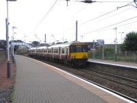 View south at Newton-on-Ayr on 2 September as 318 255 arrives with an Ayr - Glasgow Central service.<br><br>[David Panton 02/09/2009]