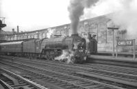Peppercorn A1 Pacific no 60157 <I>Great Eastern</I> darkens the sky over Carlisle station in the summer of 1964 as it prepares to take forward the 1.40pm Stranraer Harbour - Newcastle Central.<br><br>[K A Gray 25/07/1964]