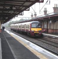 Platform view at Dumbarton Central on 21 September as 320 313 arrives with an eastbound service 21 Sep 2009<br><br>[David Panton 21/09/2009]