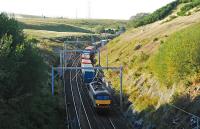 A soundbound freight has just crossed over Shap Summit. This is the view from the very high footbridge just to the south.<br><br>[Ewan Crawford 10/09/2009]
