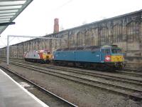 Brush Type 4 D1733 / 47853 rests in the sidings by Carlisle station. The locomotive is painted in the old XP64 Inter City prototype livery from the late 60s.<br><br>[Bruce McCartney 12/10/2009]
