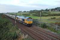 66714 (GB) 'Cromer Lifeboat' at Lochgreen south of Troon heading 4N50 1150 Lynemouth-New Cumnock empty MGR. GBRF have recently won contract for this flow. Trains started on 11th August and the contract is expected to run for eight weeks. Portland Golf course to the right of train, Royal Troon behind camera position.<br><br>[Colin Howat 25/09/2009]
