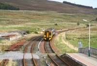 The 1101 service from Inverness to Kyle of Lochalsh drifts into Achnasheen station on 1 October 2009.<br><br>[John Furnevel 01/10/2009]