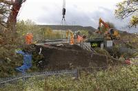 The main line through Inverkeithing has been closed over the weekend of 24/25 October. A minor bridge giving access to a cemetery to the south of the town has been replaced and track is seen here being reinstated on Sunday 25th.<br>
<br><br>[Bill Roberton 25/10/2009]