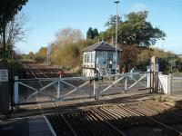 The signal box at Fiskerton station leans noticeably backwards. As can be seen here the new access steps are level but the box has a definite tilt. However, it still contains a lever frame controlling the semaphores protecting the crossing and the block section. The gates however are opened manually. View towards Nottingham. <br><br>[Mark Bartlett 25/10/2009]