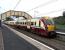 A 6-car 334 service for Glasgow Central calls at Glengarnock on 2 Sepember 2009.<br><br>[David Panton 02/09/2009]