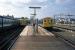 Waiting for their departure times at Watford Junction in April 1976 are the electric services to Croxley Green (left) and London Broad Street (right). Even in 1976 the short Croxley Green line seemed a  strange 'branch to nowhere' with a poor outlook, but in the event it was the substantial London terminus that closed first 10 years after this photo was taken. The Croxley Green line hung on for a further 10 years until 1996, when it succumbed to the rather underhand tactic of removal one of its bridges to facilitate a road widening scheme.<br><br>[Mark Dufton 22/04/1976]