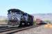 A trio of Montana Rail Link (MRL) EMD SD70ACe's nos 4314, 4312 and 4315 follows an eastbound BNSF freight through the yard at Livingston, Montana in September 2009. The trio has just helped a freight up the western slope of the Bozeman Pass and provided braking assistance on the eastern descent. The locomotives will take up position at the eastern end of the yard to await the arrival of the next westbound freight. When this train arrives it will be split in two and the three MRL loco's will be inserted in the middle and the train reassembled ready to tackle the climb to the 5,800 feet high summit.<br>
<br><br>[Andy Carr 21/09/2009]