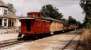 Crossroads Village is a museum village not far from Detroit. The village includes the Huckleberry Railroad, using part of the Pere Marquette Railroad trackbed. They have open-sided coaches and a rather colourful caboose.<br><br>[Ken Strachan 08/09/2001]