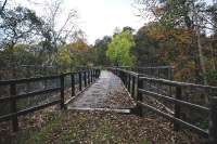 About half a mile south of Knockando is the Allt Adhair Viaduct spanning a gulley and burn for which it is named. The view is looking south over the wooden deck provided for walkers and cyclists and in the centre there is a small viewing platform looking towards the Spey.<br><br>[John Gray 21/10/2009]