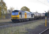 60091 <I>An Teallach</I> passes Gateshead Stadium metro station with the 6D43 Jarrow - Lindsey empty bogie tanks on 7 November. Most of this class is currently stored out of traffic.<br>
<br><br>[Bill Roberton 07/11/2009]