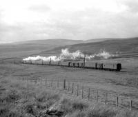 A Stanier Black 5 with a northbound parcels train photographed shortly after passing Beattock summit in the 1960s.<br><br>[A Snapper (Courtesy Bruce McCartney) //]