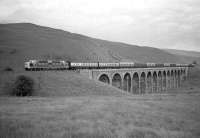 Deltic D9018 <i>Ballymoss</i> crossing Shankend Viaduct with the diverted 1A16 Kings Cross - Aberdeen ECML service on Sunday 16 July 1967. The diversion was a consequence of the derailment of the previous evening's 12-coach Edinburgh - Leeds <I>North Briton</I> near Acklington (caused by a broken rail).<br><br>[Robin Barbour Collection (Courtesy Bruce McCartney) 16/07/1967]