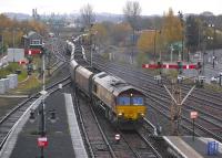View south on 16 November from the new pedestrian footbridge spanning Stirling station as 66043 crosses over to the Alloa line with a northbound coal train heading for Longannet Power Station.<br>
<br><br>[Bill Roberton 16/11/2009]