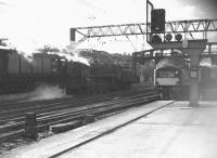 A <i>Clan</i> Pacific backs out of Glasgow Central in July 1962 as an EE type 4 arrives with a parcels train.<br><br>[Colin Miller /07/1962]
