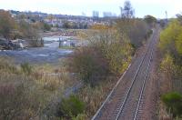 Looking east towards Dunfermline from Cairneyhill on 16 November. To the left is the former goods yard, recently vacated by a construction company and now awaiting commuters for the reopened station..... in a few years perhaps? Following the reopening of the Stirling - Alloa - Kincardine link and the rerouting of the Longannet coal trains this section currently sees very little traffic.<br><br>[Bill Roberton 16/11/2009]