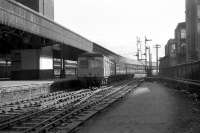 When Aberdeen's platform 6 north was blocked during the reconstruction work in 1973 [see image 20303], Inverness services departed from platform 8. Here a Swindon Cross Country set departs from 8 and takes the crossover to 9 in order to gain access to the single line to Dyce at Aberdeen North SB.<br><br>[John McIntyre 07/02/1973]