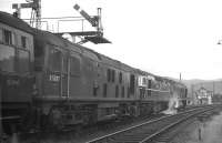Headed by two Derby Sulzer Type 2s with a BRCW Type 2 in between, <I>The Royal Highlander</I> to Euston prepares for the off at Aviemore in the Autumn of 1967. In the late 1960s and early 1970s, it was not unusual for this 1900 departure from Inverness to be triple-headed, with 16 vehicles in the consist. A restaurant car (detached at Perth after dinner service) was marshalled directly behind the locomotives, while the rest of the train was a mix of sleepers, seating coaches, parcels vans and Motorail vehicles at the tail. The ultimate multi-purpose train!<br>
<br><br>[David Spaven //1967]