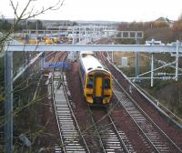 Another good vantage point bites the dust...  The 1048 ex-Waverley running under the recently installed electrification supports on the approach to Bathgate on 27 November.<br><br>[John Furnevel 27/11/2009]
