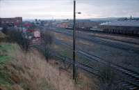 Looking south to Kilmarnock station. The two lines closest to the camera are those serving the (in 2009) closing J. Walker blending and bottling plant in Kilmarnock. The two lines run behind the camera to a reversing spur. To the right is the line from Glasgow via Barrhead, the former line from Glasgow via Dalry and CCE sidings known as <i>the Long Lyes</i>. The red brick building, distant centre, is the power signalbox with the line to Barassie behind it. To the distant left is Kilmarnock station.<br><br>[Ewan Crawford /01/1988]