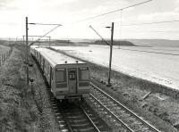 Prototype EMU 920001 approaching Ardmore West level crossing on a test run returning from Helensburgh around 1977.<br><br>[Gordon Smith Collection (Courtesy Ken Browne) //1977]