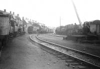 Locomotive sidings at Corkerhill shed, seen looking west in July 1966. On the left stands part of the original <I>Corkerhill Railway Village</I> [see image 19972] on which demolition commenced in 1969. Locomotives on show include Standard, Black 5 and diesel types.<br><br>[Colin Miller /07/1966]