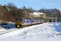 The 1045 hrs Northern Trains Manchester to Sheffield service has just called at Chinley on 23 December 2009. The Class 142 and 150 combination are seen heading eastwards, away from the camera in winter sunshine and with a blanket of snow on the ground. Merry Christmas<br><br>[John McIntyre 23/12/2009]