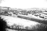 A typical winter 1967-68 Inverness scene taken from Auldcastle (as in 'Macbeth') Road. The area of empty ground to the left of the arriving train, which had been occupied by the steam roundhouse until 1960-61, was subsequently developed as an extension to the cattle auction mart, and is now home to the dubious visual delights of a Morrison's supermarket.<br>
<br><br>[David Spaven //1968]