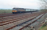 A class 47 propels a train onto the Scottish Central Railway at Greenhill Upper Junction in 1988. The view looks east with the E&G in the foreground.<br><br>[Ewan Crawford //1988]
