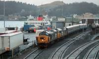 The ferry TSMV <I>Glen Sannox</I> has just arrived at Oban on a dull 27 December 1987. In the siding a class 37 has been started up. Why the two 37s I'm not sure.<br><br>[Ewan Crawford 27/12/1987]