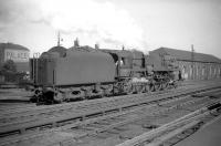 Crosti-boilered 9F 2-10-0 no 92024 at the south end of Carlisle station in July 1959. The 9F was one of 3 of this type transferred to Kingmoor shed for a time. [See image 34814]<br><br>[Robin Barbour Collection (Courtesy Bruce McCartney) 04/07/1959]