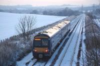 <I>Cold?   Perish the.. th.. th.. thought! </I> 170 396 coasts downhill towards Inverkeithing station on 28 December 2009  heading for Waverley with the 16.18 ex-Glenrothes with Thornton<br>
<br><br>[Bill Roberton 28/12/2009]