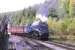 <I>Clear the way!</I> No 7 whistles for the level crossing with a Grosmont - Pickering train at Levisham on 1 October 2009.<br>
<br><br>[Colin Miller 01/10/2009]