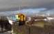 150 256 heads a train to Barry Island into Grangetown station on a  stormy afternoon. The white structure on the right is the Cardiff  Millennium Stadium.<br><br>[John Thorn 04/11/2009]