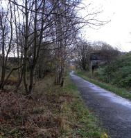 Please refer to map [see image 23914] and imagine yourself on the line to the left of 'Flour Mills' (the original Chancelot Mills) looking south. The 'LNER Loop Line' went through the trees to the left, and the abutments of that overbridge at the end of Dalmeny Road survive. A direct connection between Granton Harbour and Leith Docks must surely have been of limited use, and the map suggests the junction was already severed. <br>
<br><br>[David Panton 25/11/2009]