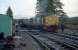 Early morning at Tulloch during Christmas 1987. The northbound sleeper, hauled by 37423, has drawn forward of the crossing between platforms due to its length. At the southbound platform is the morning train for Glasgow (37407 <i>Loch Long</i>). The train crews swap over across the tracks (they also guided a dismounting passenger). Slippery diesel was spilled all over the footway so crunching across the ballast might have been a better option anyway. Tulloch was very much in use as a maintenance base at the time, with lots of equipment lying alongside the platers hut on the left.<br><br>[Ewan Crawford 29/12/1987]