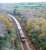 The morning Goonbarrow Junction to Fowey loaded China Clay train heads south from Luxulyan. The view is from Treffy's viaduct and the train is on a 'new' section of line which replaced a nearby incline and, sadly, Treffy's Viaduct.<br><br>[Ewan Crawford 18/11/2009]