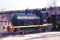 A close up of<I> Lancaster</I>, one of two fireless locos that shunted coal wagons at the power station until it closed in 1981. On the left behind the buildings a footbridge spans the former mainline in front of the canal aqueduct. For the same view more than 40 years on [see image 27041]. <br><br>[David Hindle //1968]