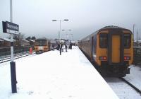 Fresh snow at Morecambe, and more threatened, as 156469 waits to depart for Lancaster and 144011 is on immediate turnround to return to Leeds via Lancaster and Skipton. <br><br>[Mark Bartlett 05/01/2010]