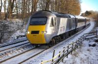 The <I>East Coast</I> 07.52 Aberdeen-London Kings Cross HST service, led by 43251, running through a snowy landscape near Dalgety Bay on 5 January 2010. The train was running approximately 40 minutes late at this point. <br><br>[Bill Roberton 05/01/2010]