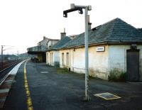 Looking along the platform at Carstairs towards Carlisle in August <br>
1997. The odd-looking post in the foreground once held an early, <br>
monochrome departures monitor. The screens were removed when the line from Edinburgh was electrified in 1991. With diesel-hauled trains no longer needing to call here to link up to an <br>
electric for the journey south (and vice-versa) the number of services calling here was greatly reduced. Even now (2010) electronic information is not deemed necessary here. <br>
<br><br>[David Panton 29/08/1997]