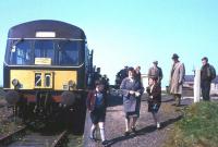 The 2.15 pm from Fraserburgh to St Combs has just arrived at the light railway's terminus on Saturday 1st May 1965, the last day of operation. The photographer's father-in-law and son (who would rather be at a football match) watch proceedings on the right. <br><br>[Frank Spaven Collection (Courtesy David Spaven) 01/05/1965]
