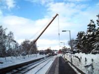 Platform scene at Carrbridge station on 11 January with container recovery ongoing.<br><br>[Gus Carnegie 11/01/2010]