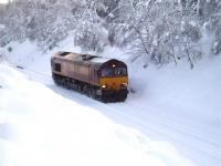 <I>Here comes the cavalry... </I> EWS 66112 makes its way through the snow en route to the Carrbridge crash site on the morning of 11 January 2010 to provide assistance with the ongoing container recovery operation.<br><br>[Gus Carnegie 11/01/2010]