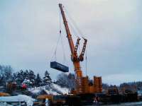 Under fading light at Carrbridge on 11 January the Ainscough crane (the 5th crane to be used) works flat out lifting the containers. [See addendum to today's Railscot News Item.]<br><br>[Gus Carnegie 11/01/2010]