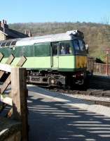 First train of the day from Pickering, hauled by D7628, waits at the level crossing at Levisham on a fine spring morning in April 2009, before continuing its journey north with a service for Grosmont.<br><br>[John Furnevel 20/04/2009]