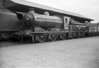 Reid class J37 0-6-0 no 64618 stands with a black 5 alongside the covered loading dock in Dundee's ex- Caledonian goods yard on 29 July 1958 [see image 20937]. Both locomotives look ready for the road, with the J37 (which spent most of its life at Thornton Junction) looking exceptionally clean. This has prompted suggestions that it had either been prepared to handle a railtour, or was on its way back to Thornton from a visit to Inverurie works.<br><br>[Robin Barbour Collection (Courtesy Bruce McCartney) 29/07/1958]
