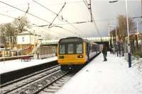 A service heading to Hazel Grove from Preston in the hands of 142046 calls at a snowy Leyland on 23 December 2009.<br><br>[John McIntyre 23/12/2009]