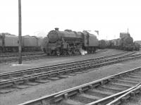 Black 5 no 44719 with assorted accompaniment at the west end of Corkerhill shed yard in July 1962.<br>
<br><br>[Colin Miller /07/1962]